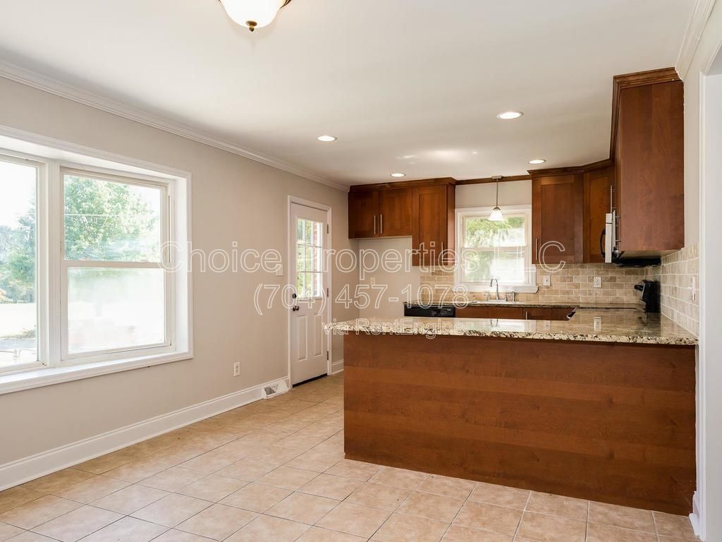 All brick, corner lot with open floor plan, huge kitchen with granite countertops! property image